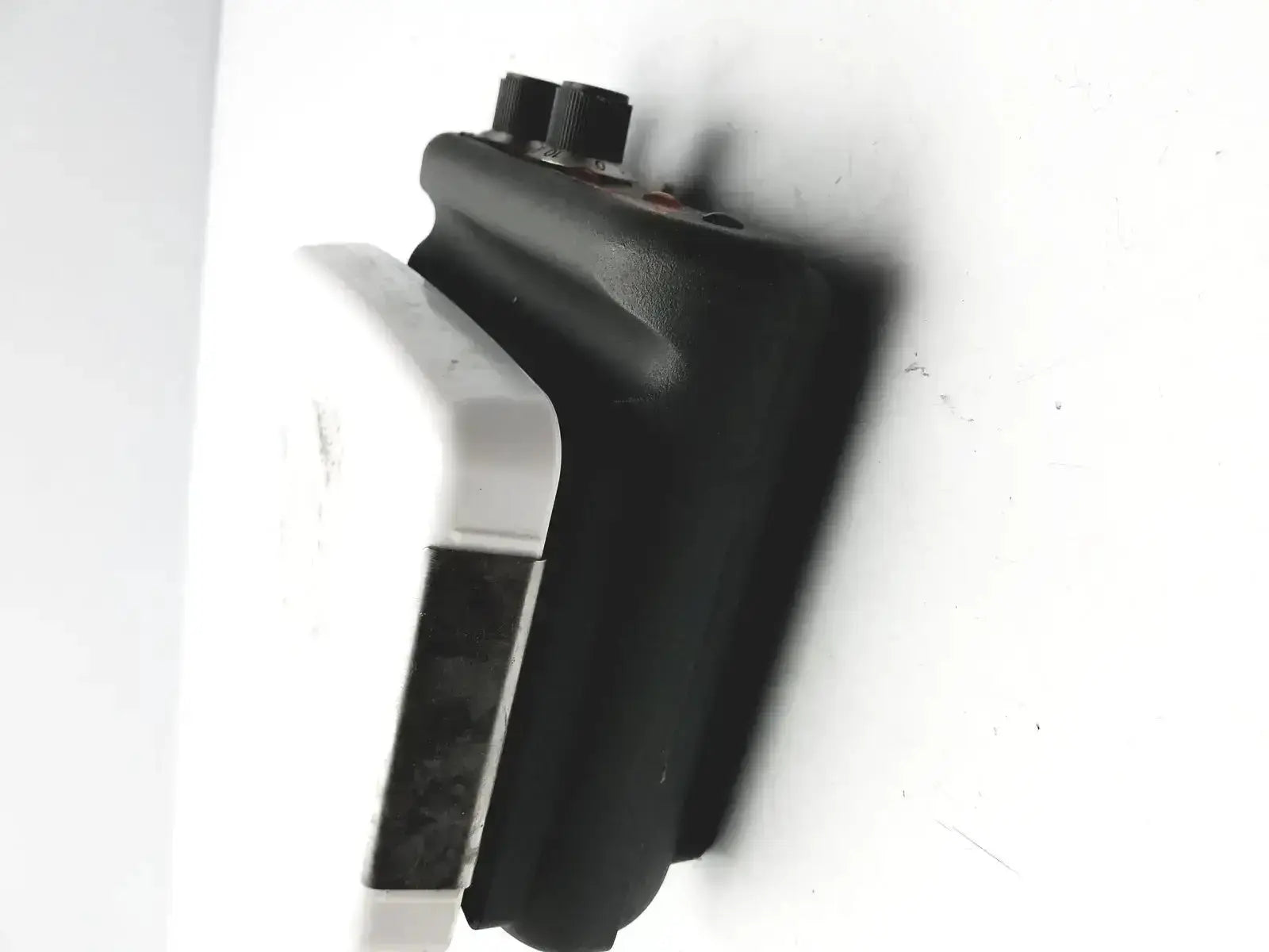 Black plastic walkie-talkie with two knobs on top alongside corning pc420 magnetic hot plate stirrer mixer hot plate