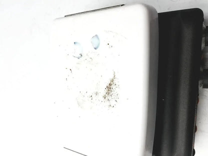 White plastic wall-mounted soap dispenser with residue buildup shown alongside corning pc420 magnetic hot plate stirrer