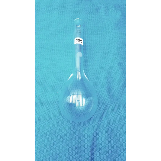 Clear glass volumetric flask with a narrow neck and bulbous body, marked ’250 ml’ on its side.