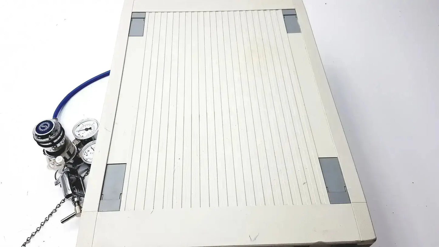 Beige rectangular welding table with vertical ribbed surface and gray corner reinforcements for cosmed quark b2 pulmonary use