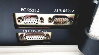 Back side of cosmed quark b2 pulmonary gas exchange device showing three metallic rs232 serial ports labeled pc aux extens