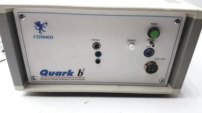 White COSMED Quark b2 pulmonary gas exchange analyzer with green power button and labeled ports for pulmonary gas exchange