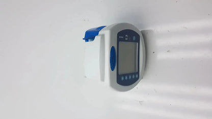 White and blue digital blood pressure monitor with rectangular screen and circular buttons used with Covidien Kangaroo enteral feeding pump