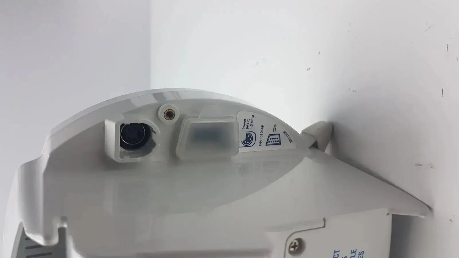 White plastic Covidien Kangaroo enteral feeding pump device with black lens security camera and attached sensor module
