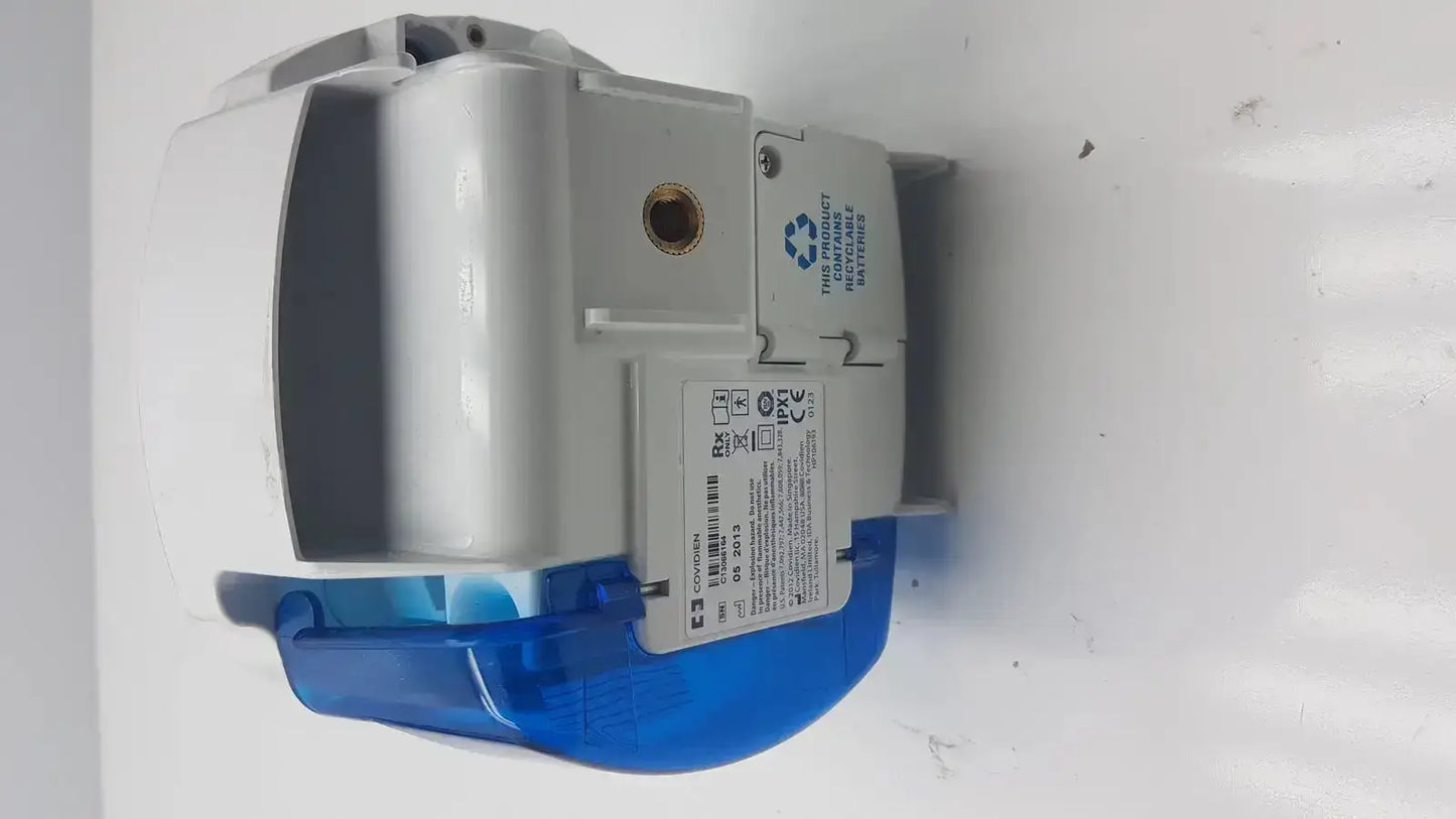 Gray and blue plastic enteral feeding pump water meter with white label showing technical specifications for Covidien Kangaroo pump
