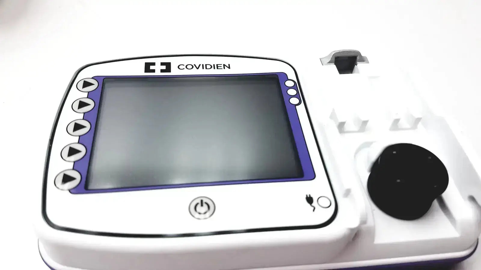 White and purple covidien kangroo feeding pump with touchscreen buttons power button and pole clamp charging port
