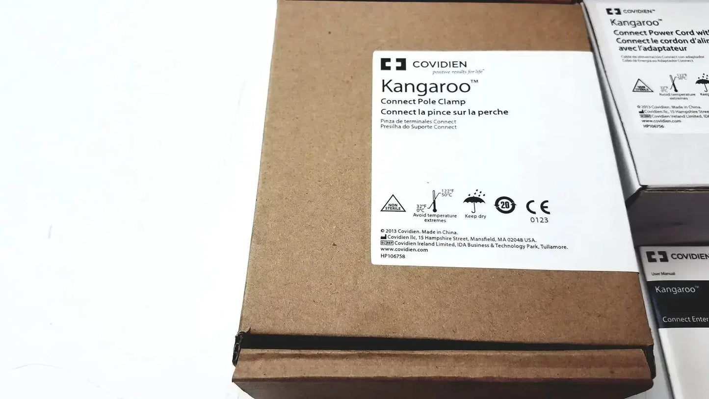 Brown cardboard box labeled covidien kangroo pole clamp for feeding pump connect pole clamp and extras product packaging