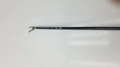 Black-handled covidien ligasure maryland jaw sealer divider with metallic curved tip and engraved text on shaft