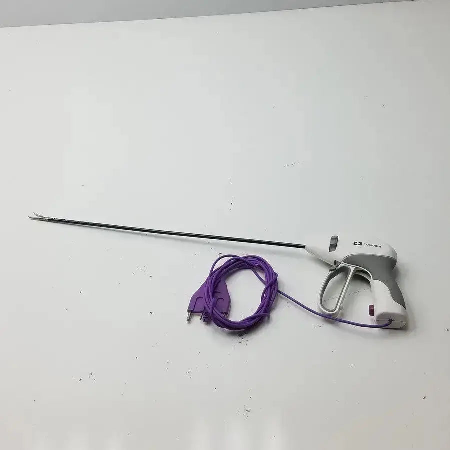 Gray and white covidien ligasure maryland jaw sealer divider with long black shaft purple power cord and ergonomic handle