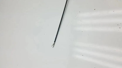 Black metal covidien ligasure maryland jaw sealer divider with slender curved tip and fine serrations along shaft