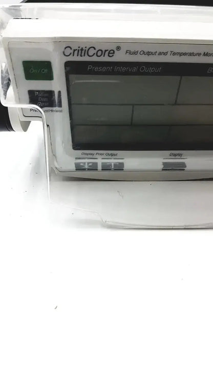White criticore fluid output and temperature monitor model 000002n with a digital screen displaying medical data