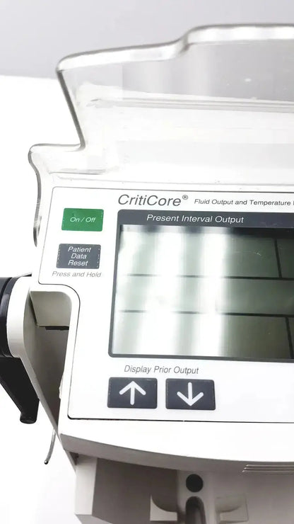 White plastic criticore fluid output and temperature monitor model 000002n with digital screen displaying data