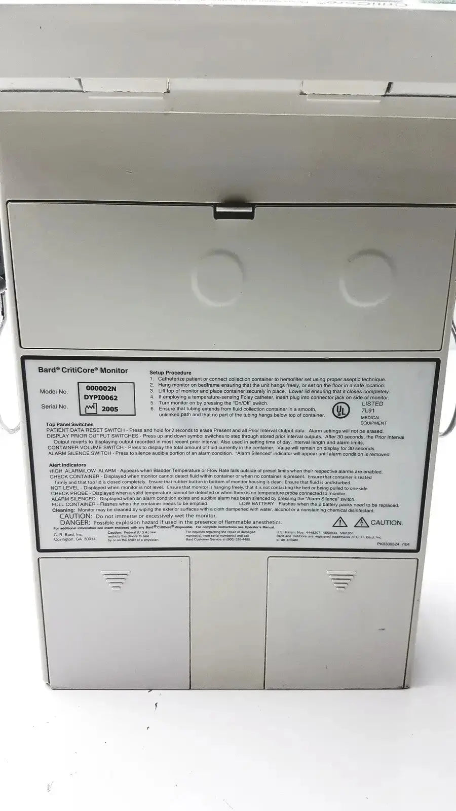Black and white label with printed text showing specifications of barco criticore fluid output temperature monitor model 000002n