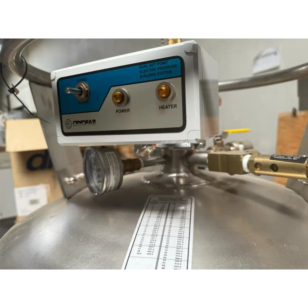 White and blue cryofar dual set-point electric pressure building system control panel with brass power and heater switches.