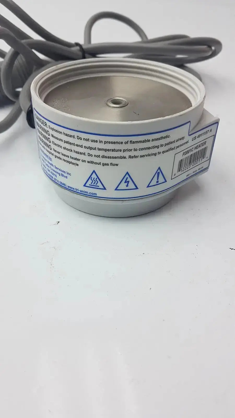 Silver cylindrical fabric humidifier heater p2001c with coiled gray power cord and safety warning label by curaplex 301-p2001