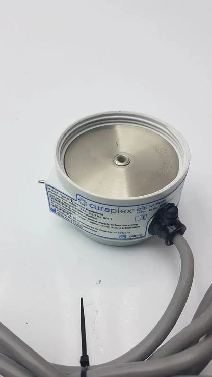 Silver cylindrical humidifier heater p2001c with metallic top and black connector labeled curaplex 301-p2001