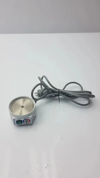 Gray coiled power cord attached to compact cylindrical metallic humidifier heater p2001c curaplex 301-p2001 device