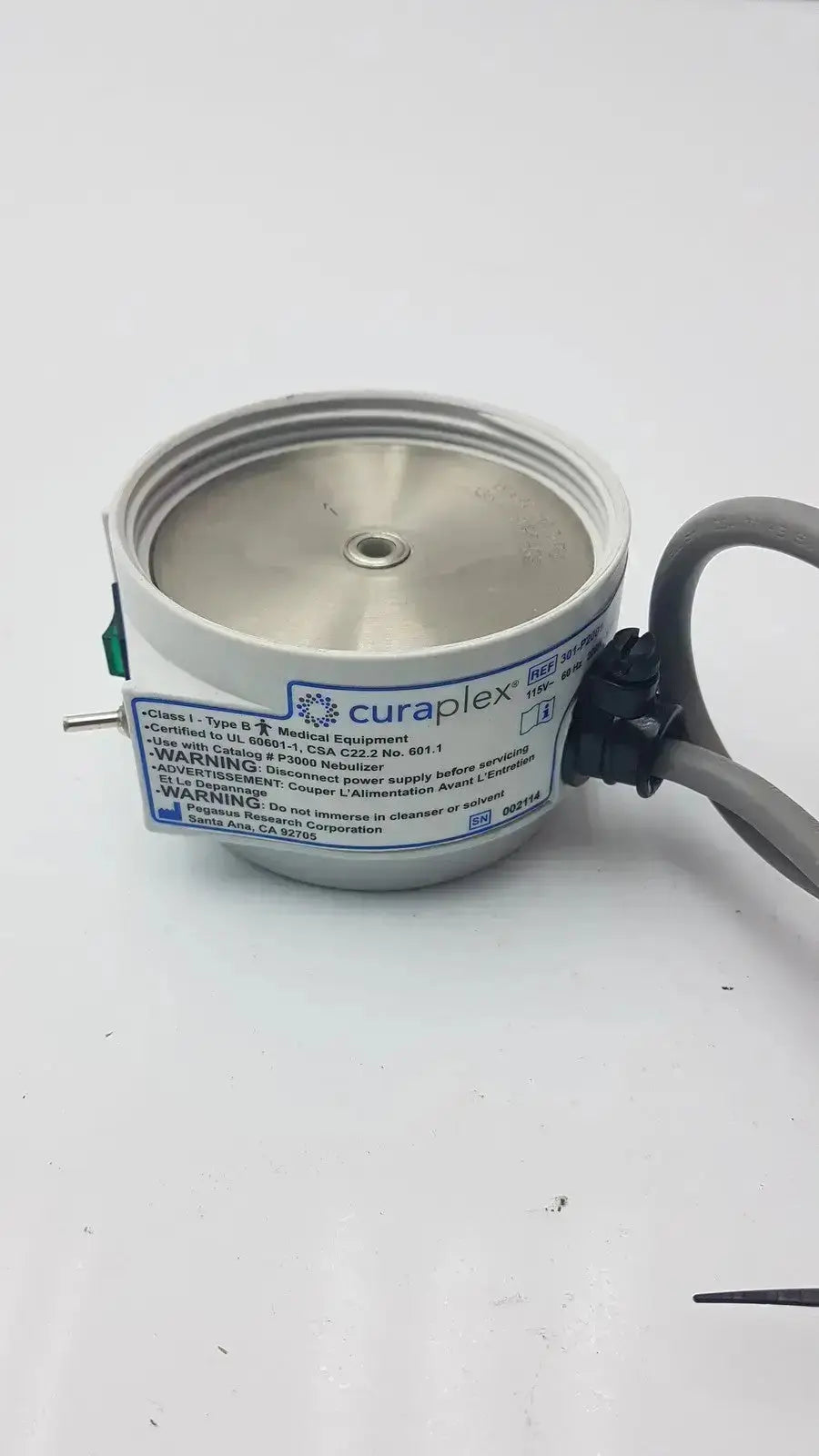 Silver cylindrical curaplex 301-p2001 humidifier heater p2001c with black cable and green connector