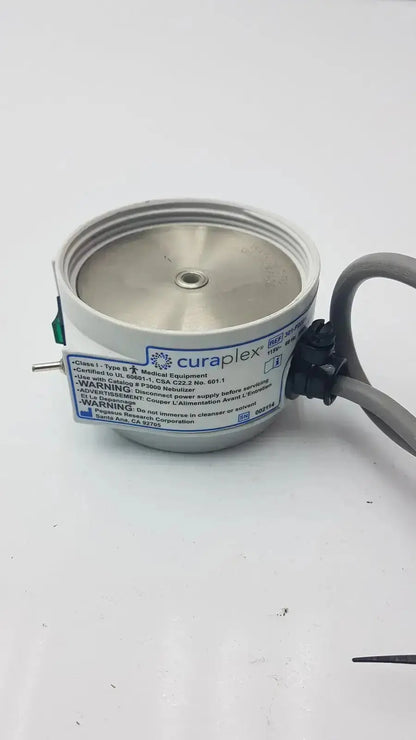 Silver cylindrical curaplex 301-p2001 humidifier heater p2001c with black cable and green connector