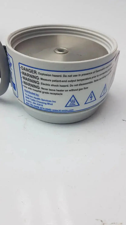 Silver metallic cylindrical medical gas cylinder with white label and warnings for curaplex 301-p2001 humidifier heater p2001c