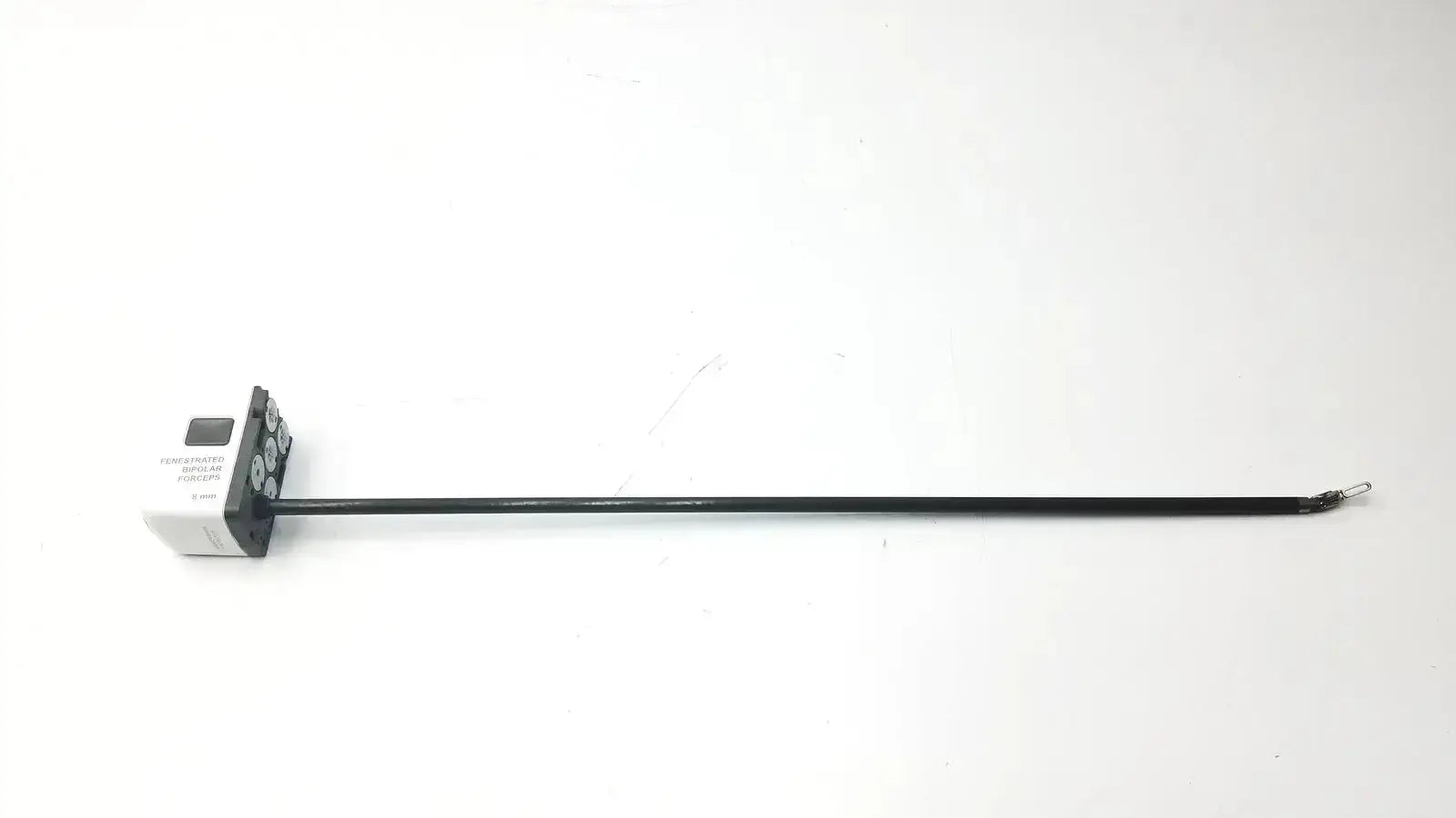 Black fenestrated bipolar forceps 8mm with white base featuring circular ports and digital display for precise control