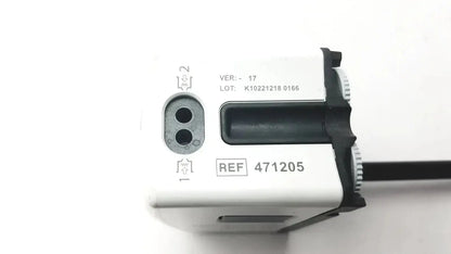 White and black digital camera flash with textured grip shown alongside da vinci xi 471205 fenestrated bipolar forceps 8mm