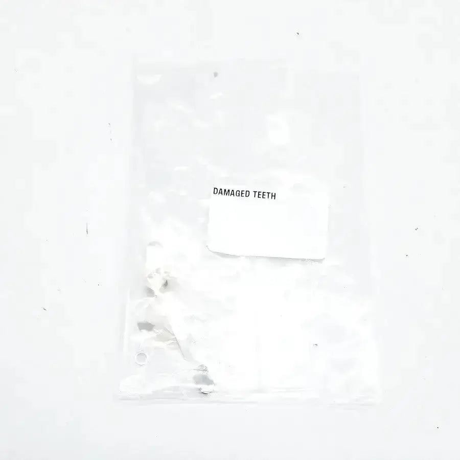 Damaged teeth portrait ipn c1 p21 showing damaged teeth in a clear plastic bag with a white label