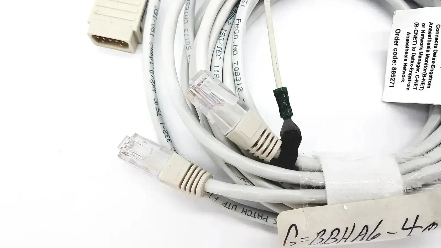 White Datex-extension mon aic network cable 20ft with clear RJ45 connectors and beige plastic housing coiled neatly