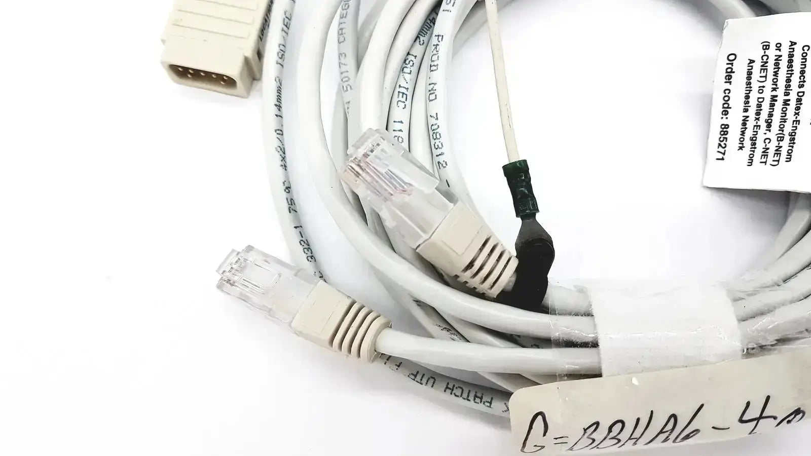 White Datex-extension mon aic network cable 20ft with clear RJ45 connectors and beige plastic housing coiled neatly