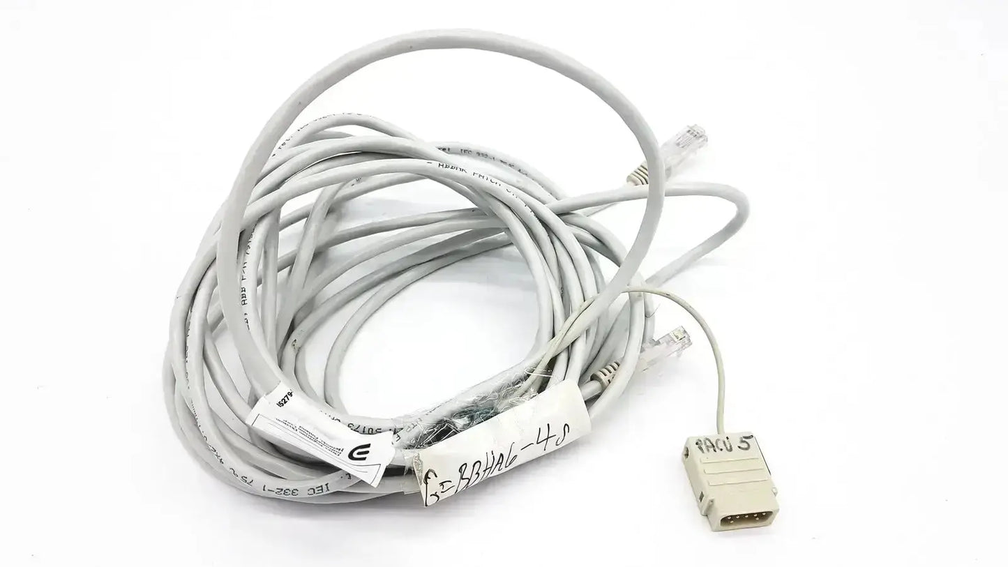 Gray coiled Datex-Extension mon aic network cable 6m with beige rj45 connector and printed labels for network use