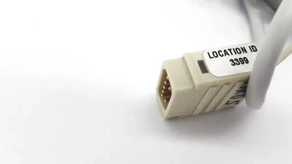 Beige Datex extension mon AIC network cable connector with gold-plated pins and location id 3399 label