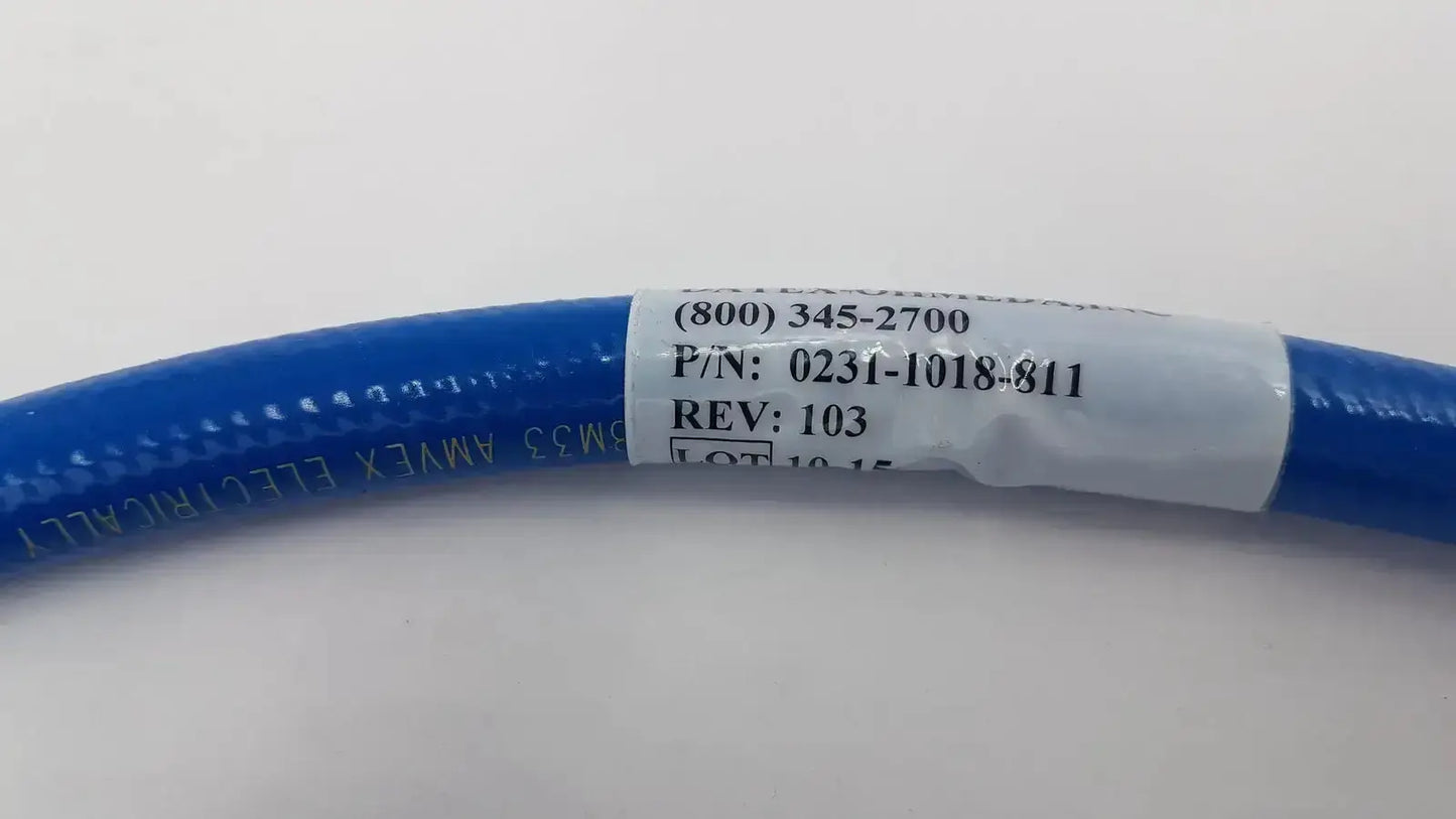 Blue flexible hose assembly with white label showing part number and revision for datex ohmeda hospital surplus use