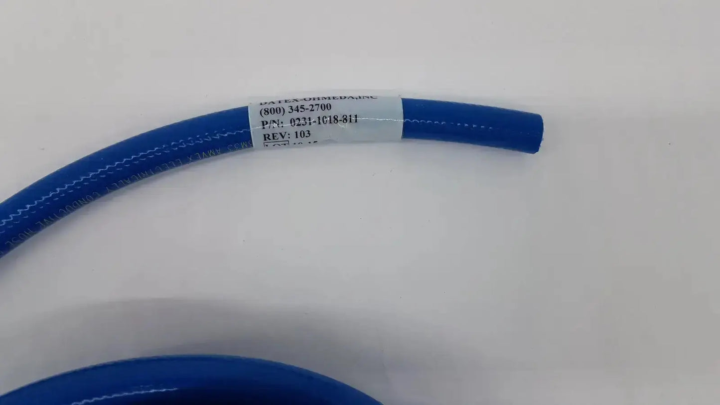 Blue coiled silicone hose assembly with white label datex ohmeda hospital surplus product for medical use