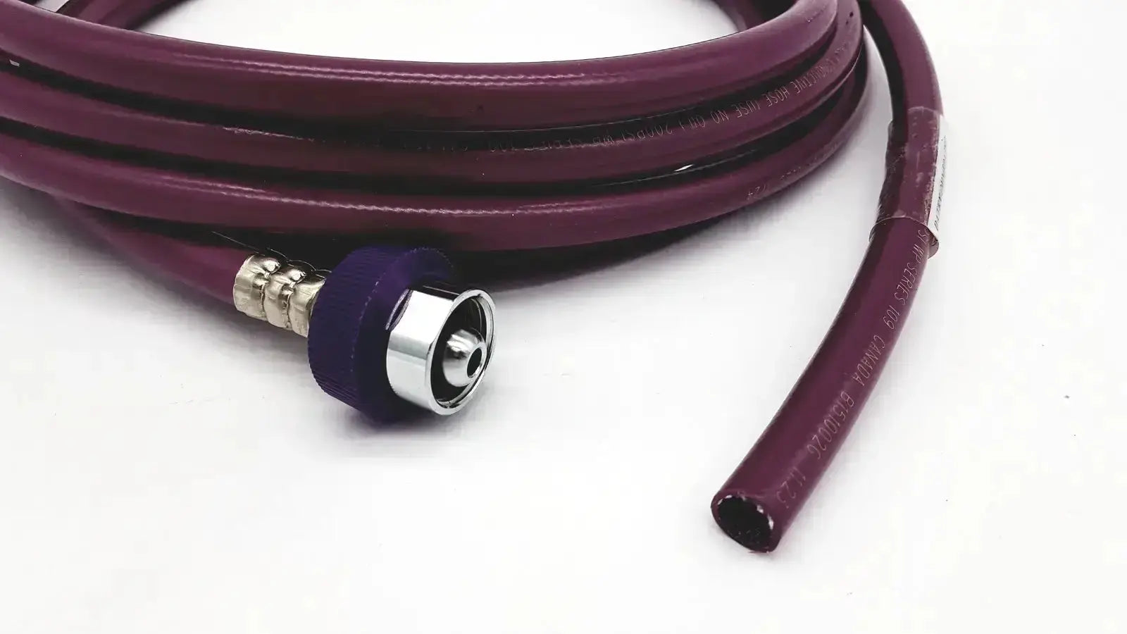 Purple coiled datex ohmeda hose assembly evacuation with metallic connector and purple rubber cap