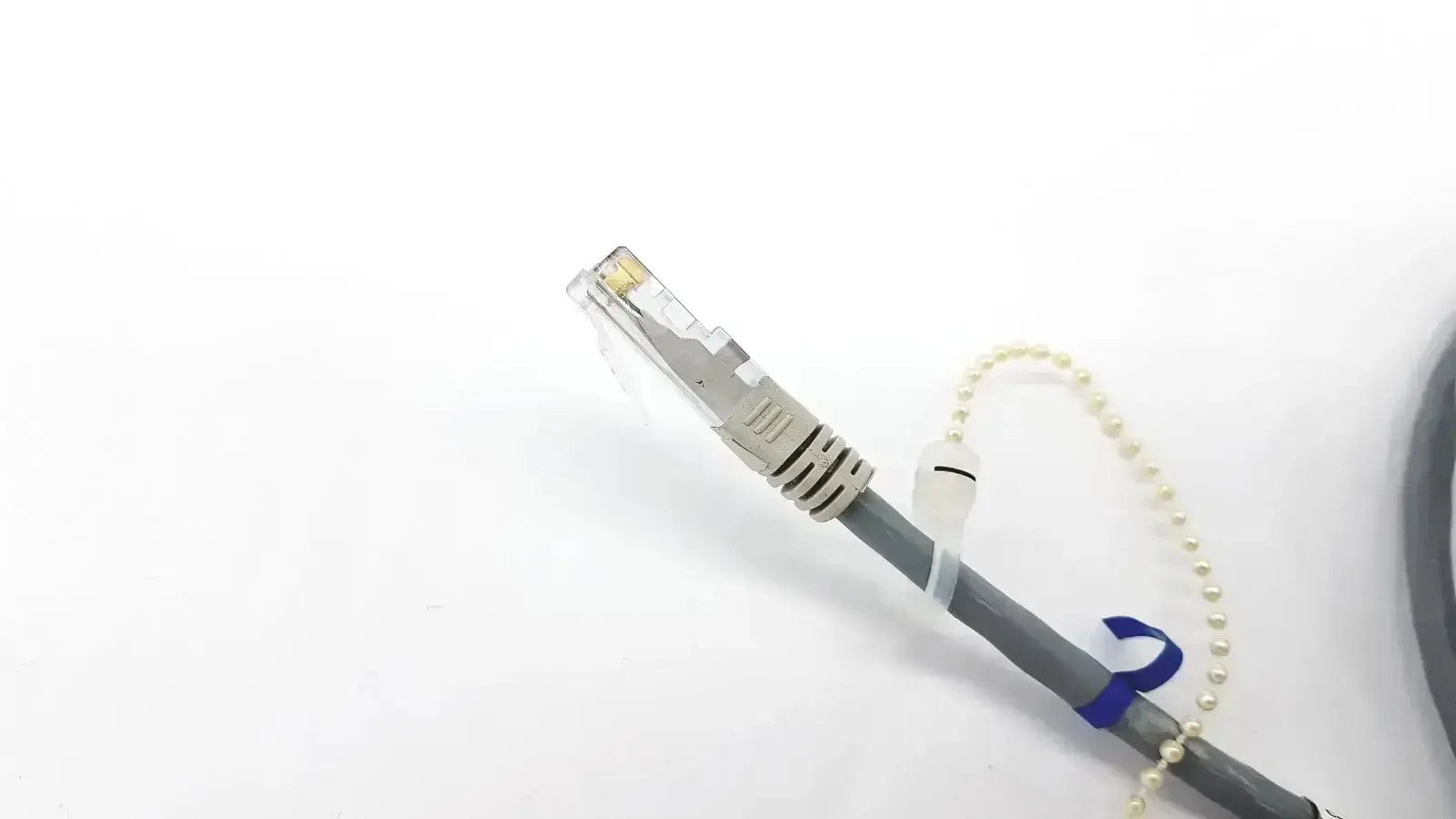 Gray Datex Ohmeda mon ic network cable with silver rj45 connector and pearl chain, 10ft length