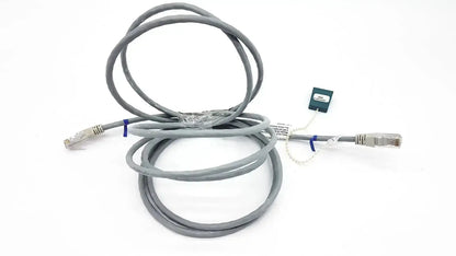 Gray Datex Ohmeda mon ic network cable with silver RJ45 connectors and green tag, 10ft length