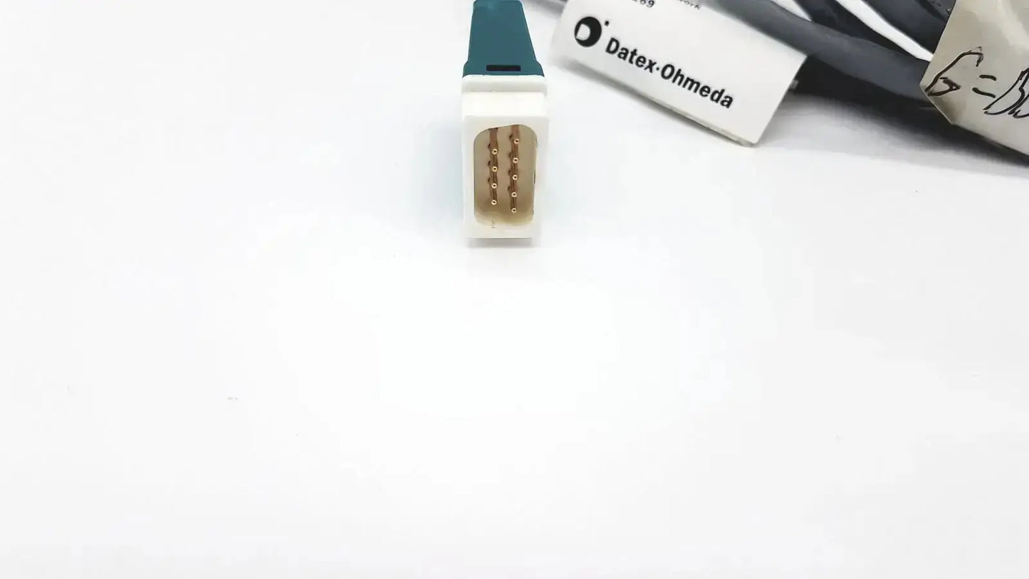 White and teal Datex Ohmeda mon ic network cable with gold-colored pins 10ft length model 885269 connector