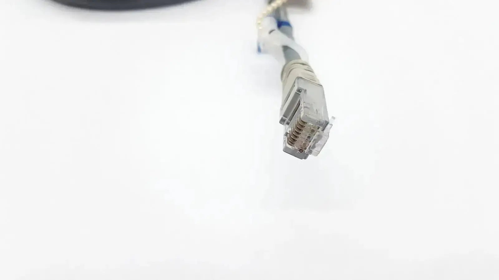 Gray datex ohmeda mon ic network cable with clear plastic connector housing and metallic pins 10ft length