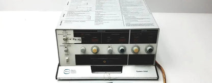 Silver and black davol electro medical system 5000 electronic test equipment with dials, switches, and front panel display