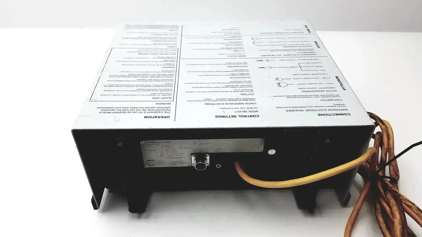 Black rectangular davol electro medical system 5000 with white instruction label and orange cables connected at back side