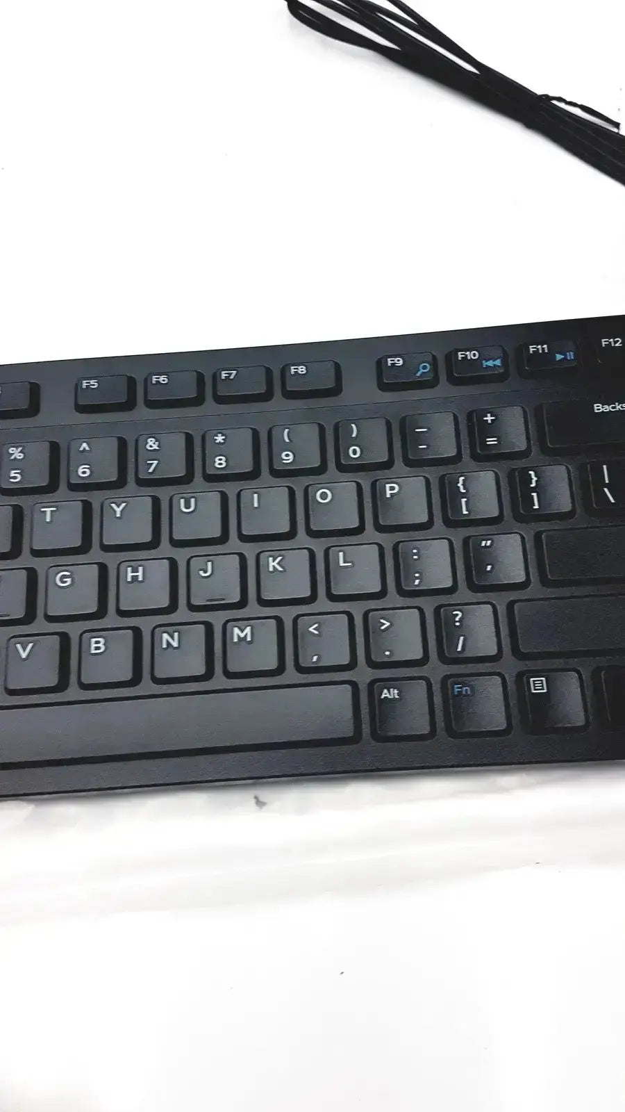 Black plastic dell kb216-bk-us wired keyboard with white lettering and standard qwerty layout for efficient typing