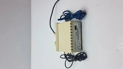 Beige rectangular dentsply cavitron 3000 prophylaxis unit type-gen power supply with black and blue coiled cables