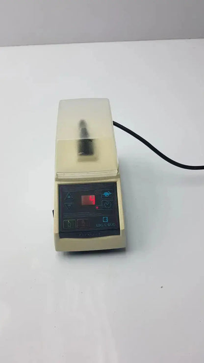 Beige dentsply rinn crescent laboratory-grade vortex mixer with transparent lid and digital control panel