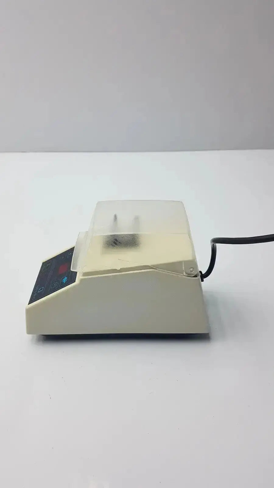 Beige dentsply rinn crescent laboratory centrifuge with clear plastic lid and black control panel for mixing applications