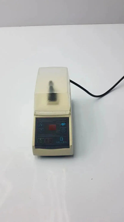 Beige dentsply rinn crescent laboratory centrifuge with transparent lid and control panel featuring red button and blue icons