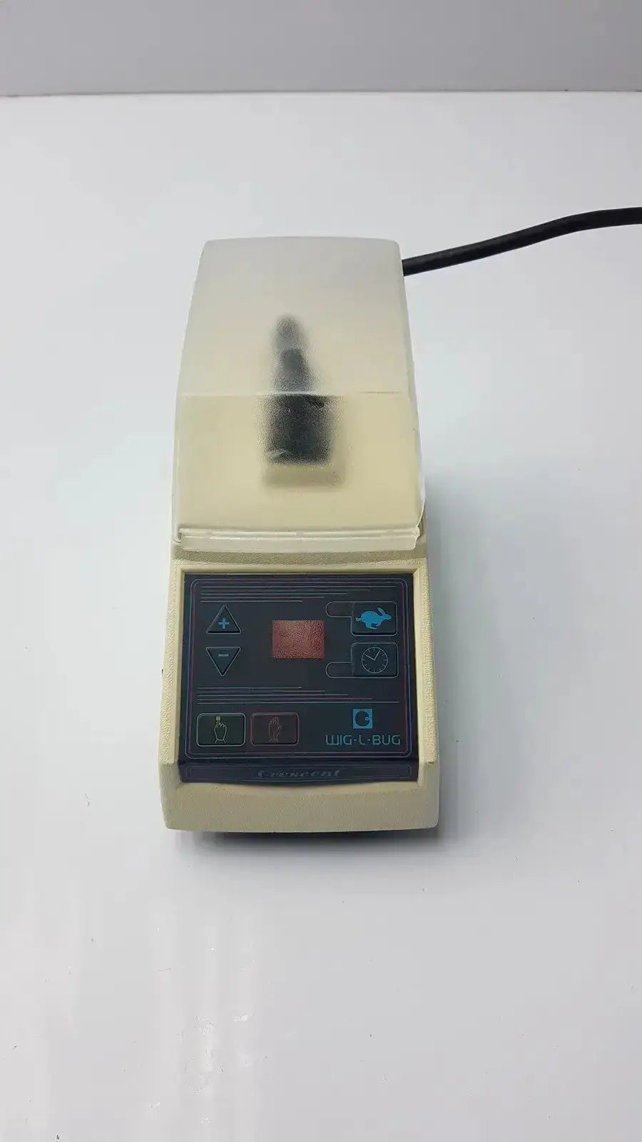 Beige laboratory-grade dentsply rinn crescent WIG-L-BUG mixer with transparent lid and digital control panel