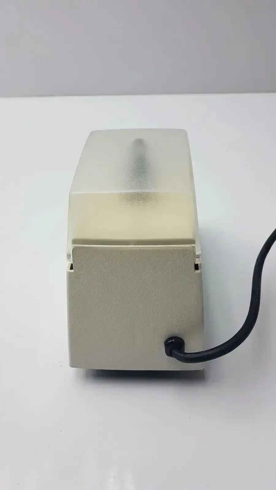 Beige plastic electric tissue dispenser with translucent top and black power cord for dentsply rinn crescent mixer msd