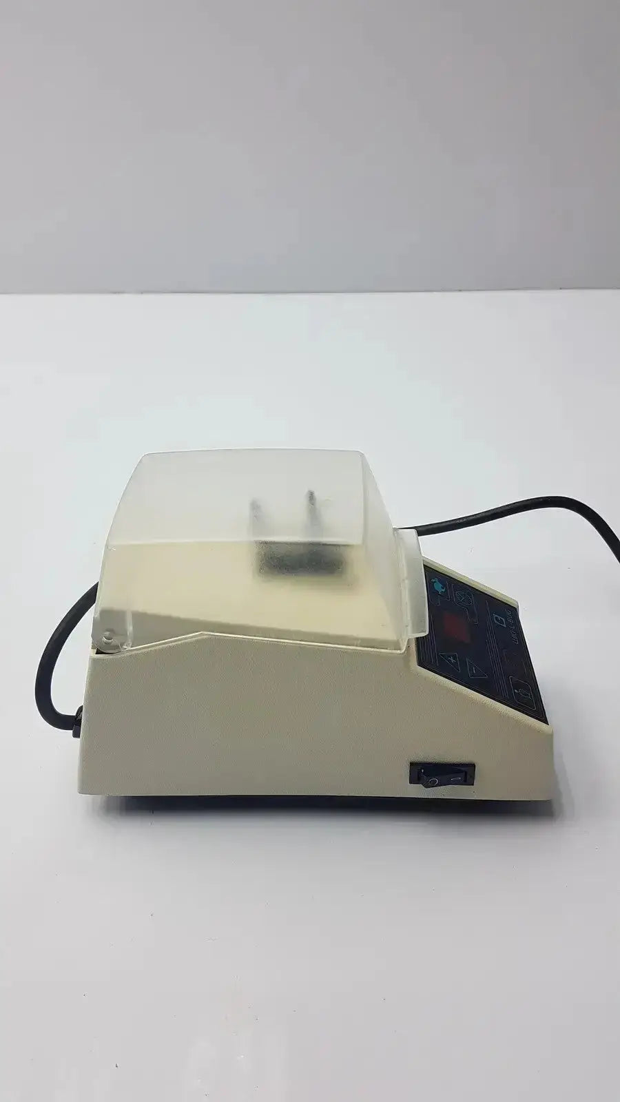 Beige dentsply rinn crescent laboratory centrifuge with transparent lid and digital control panel for mixing samples