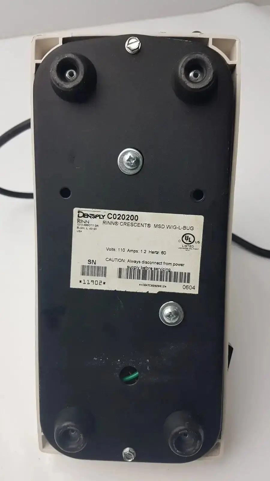 Black rectangular electronic dentsply rinn crescent mixer with silver screws and white label featuring densply brand name