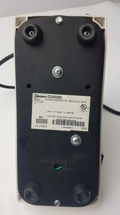 Black rectangular electronic dentsply rinn crescent mixer with silver screws and white label featuring densply brand name